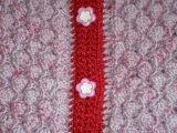 Pletený kojenecký svetřík s čepičkou